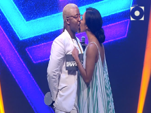 Cassper Nyovest gets his award and a kiss. 