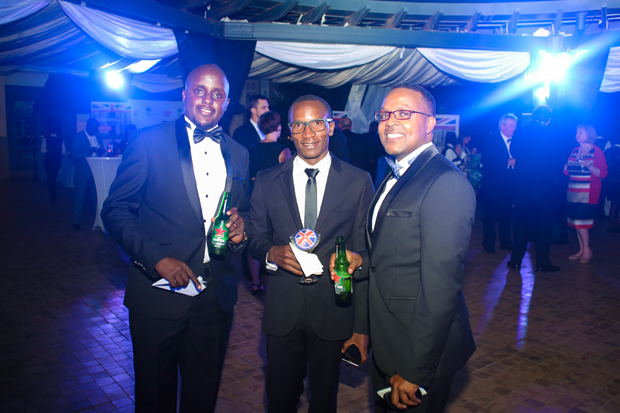 Heineken's Akandwanaho (L) and Steven Baryevuga (R), with Bayimba Foundation's Faisal Kiwewa.