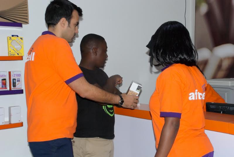Africell's Commercial Director, Milad Khairallah (L) and other Africell staff. 