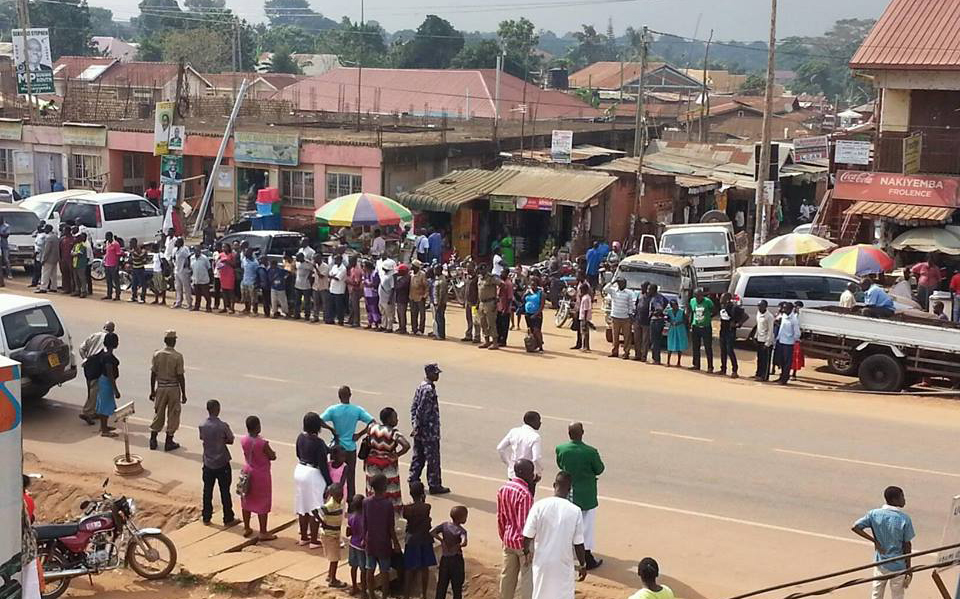 Commuters desparately wait for taxis on Entebbe Road. 