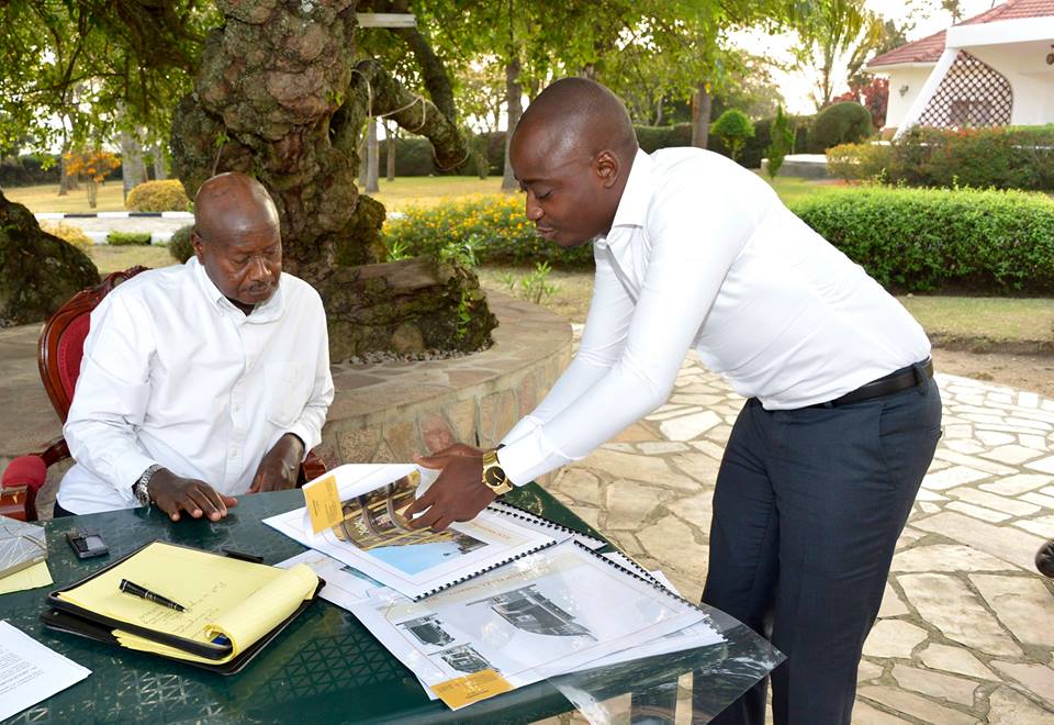 Ham shows President Museveni his plan for the development of Nakivubo Stadium.