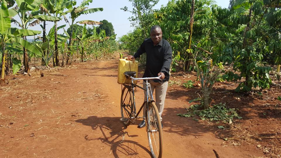 Lukwago fetching water from the village well. 