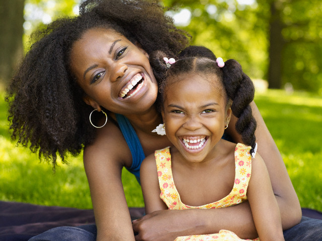 mother and daughter laughing --- Image by © Granger Wootz/Blend Images/Corbis