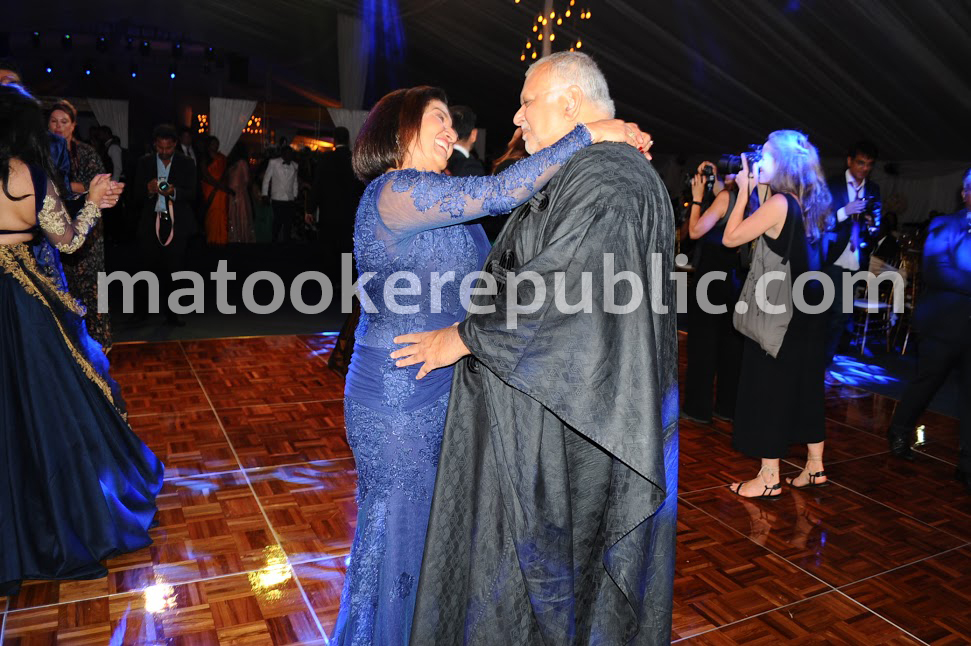 The girls are gone, but we still have each other. Sudhir and his wife dance. 