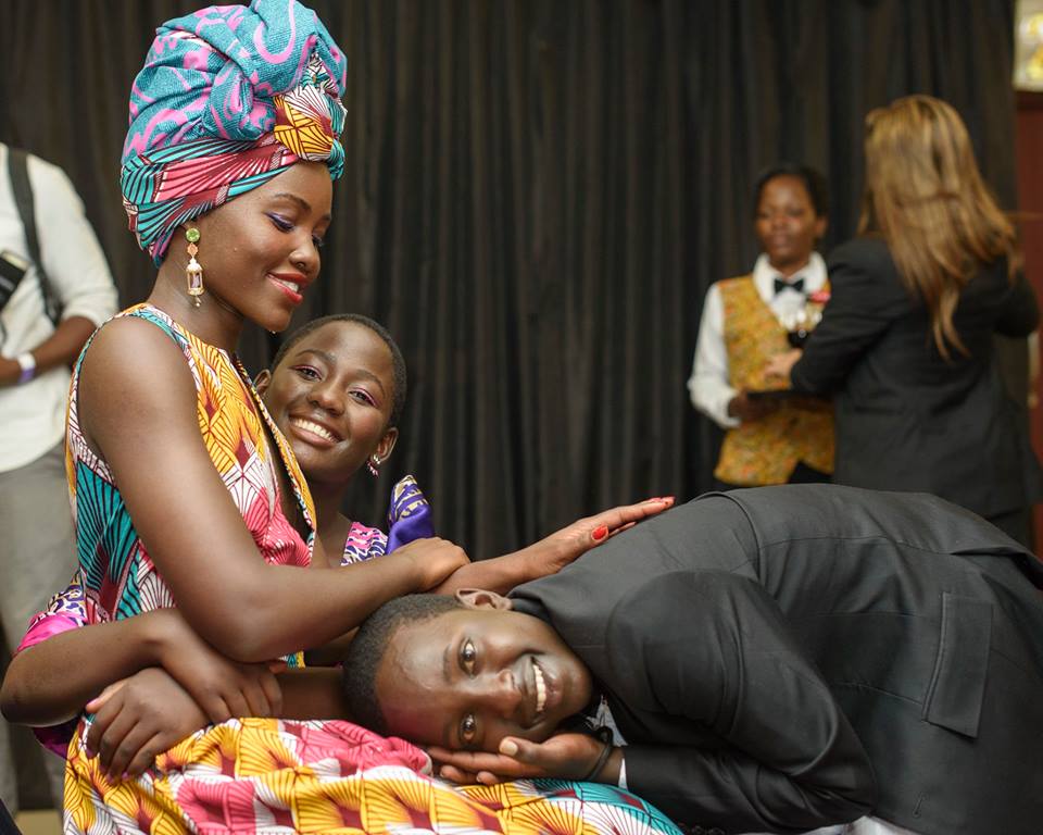 Lupita Nyong'o poses with her on-screen children, Madina Nalwanga and Martin Kabanza. 