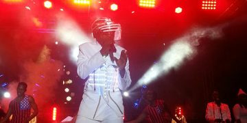 David Lutalo in a futuristic outfit on stage.