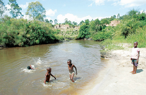 Children play in River Rwizi.