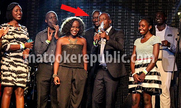 Bush Baby wears a smile as Malcolm Musiime gives an acceptance speech on behalf of NTV staff.