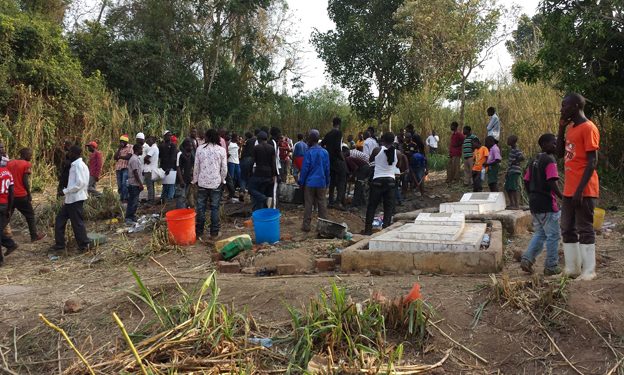 Mourners at AK 47's grave site in Kalangalo village, Mityana district.