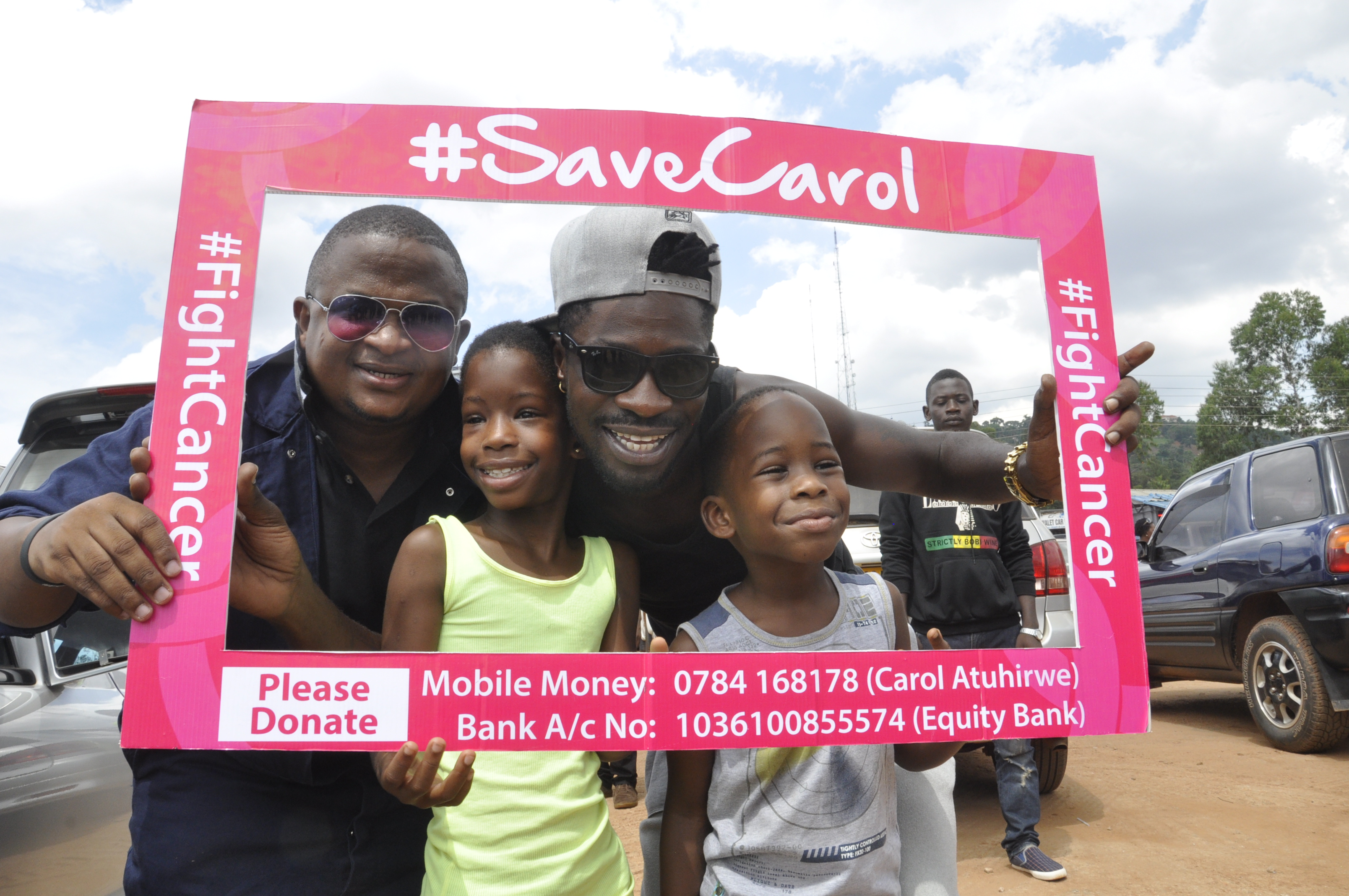Muhereza Kyamutetera and musician Bobi Wine's family at the Save Carol carwash at Panamera.