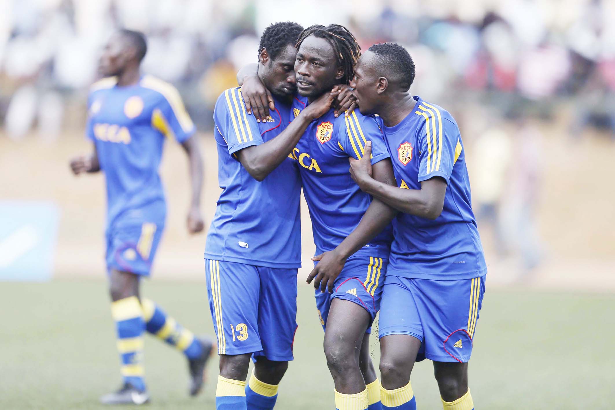 Brian Umony (C) of KCCA FC celebrate his goal with teammates William Wadri (L) and Tom Masiko against El-Merreikh during their Cecafa Kagame Club Cup 2014 semi finals match at Kigali Regional Stadium in Nyamirambo on August 22,2014. El Merreikh won 3-0 on post match penalties. Photo/Stafford Ondego/www.pic-centre.com/CECAFA (RWANDA)