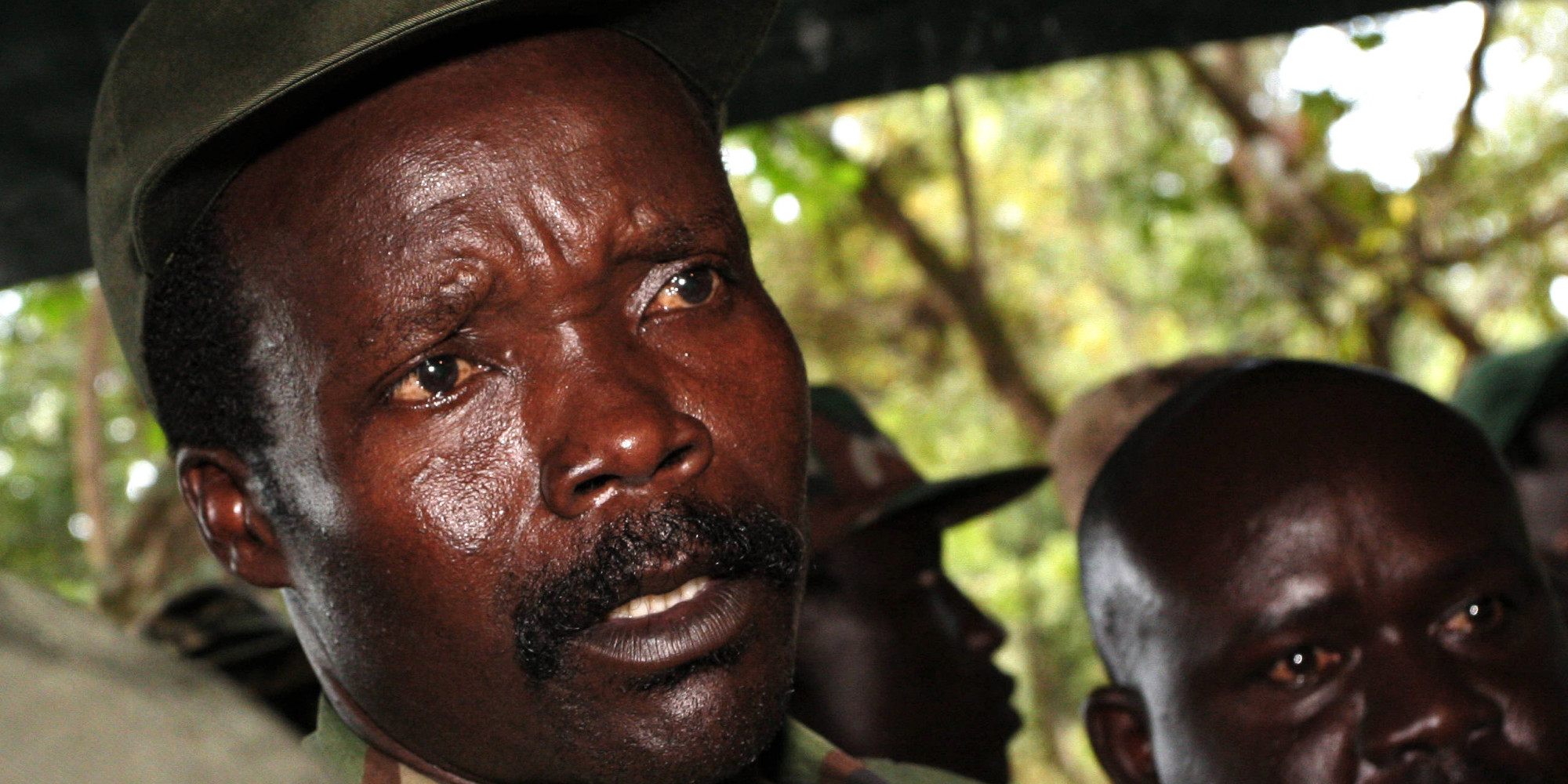 FILE - In this Nov. 12, 2006 file photo, the leader of the Lord's Resistance Army, Joseph Kony answers journalists' questions following a meeting with UN humanitarian chief Jan Egeland at Ri-Kwamba in southern Sudan. Ten years ago the international treaty that created the ICC came into force, creating the world's first permanent war crimes tribunal.  The head of a planned African Union force to hunt warlord Joseph Kony said on Wednesday, July 25, 2012,  that he can't start his task because he doesn't have troops, equipment or the necessary funding. (AP Photo/Stuart Price, File, Pool)