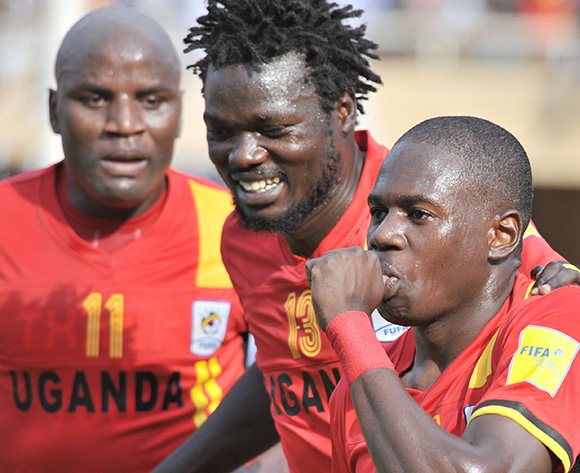 (L-R) Farouk Miya and Moses Oloya are joined by Geoffrey Massa of Uganda as they celebrate a score against Congo Brazzaville during the 2018 World Cup Qualifiers on 12 November 2016 at Mandela Stadium, Namboole. ©Ismail Kezaala/BackpagePix