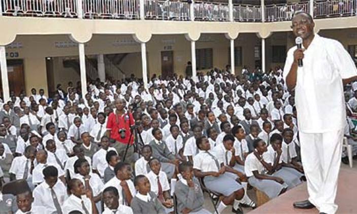 Mukiibi addresses students at one ofhis campuses.