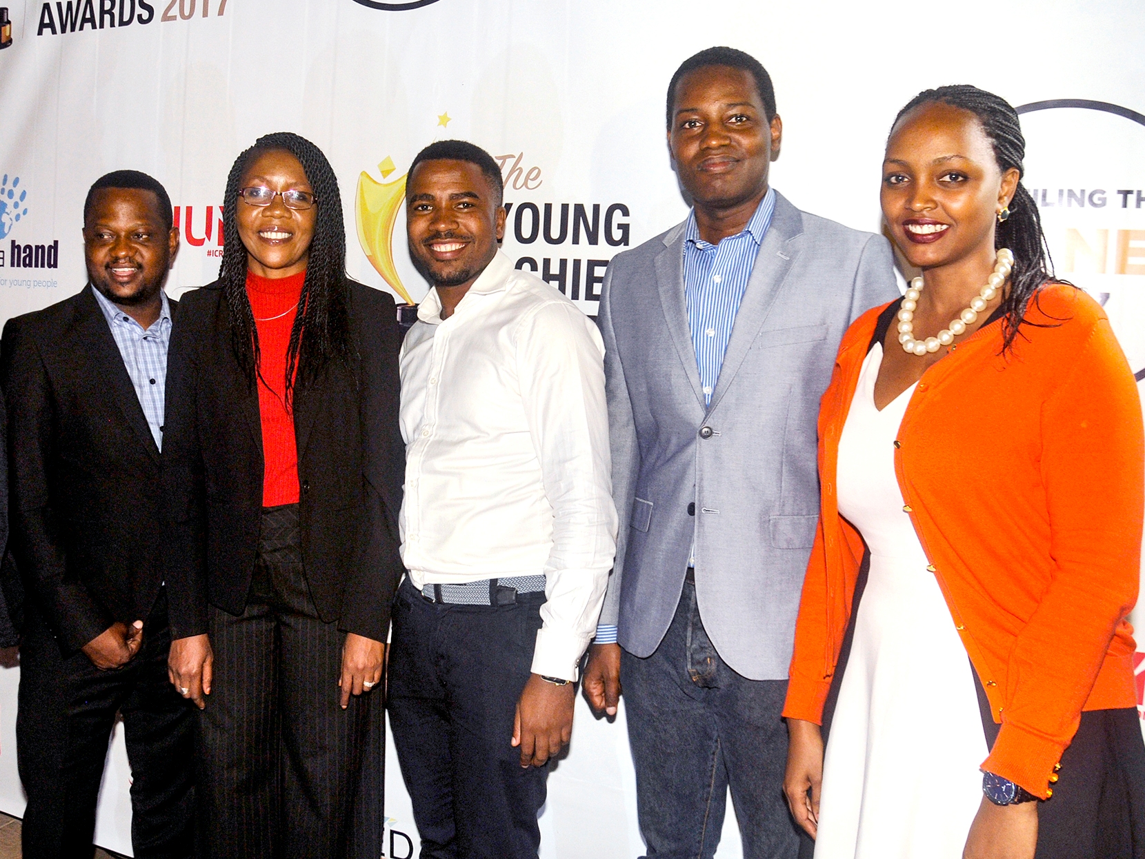 Chairperson, Reach A Hand Uganda, Joe Kigozi; Progress Chisenga, Marketing Director, Vodafone Uganda; Humphrey Nabimanya, Team Leader and Founder, Reach A Hand Uganda; Ivan Kyambadde, Co-Founder- Young Achievers Awards;  and Fiona Kayitesi, Youth Program Manager, Vodafone Uganda pose for a photo at the Young Achievers Awards nominee unveiling event recently at Kampala Serena Hotel. Vodafone JUMP is partnering with Reach A Hand to together inspire and empower young people.