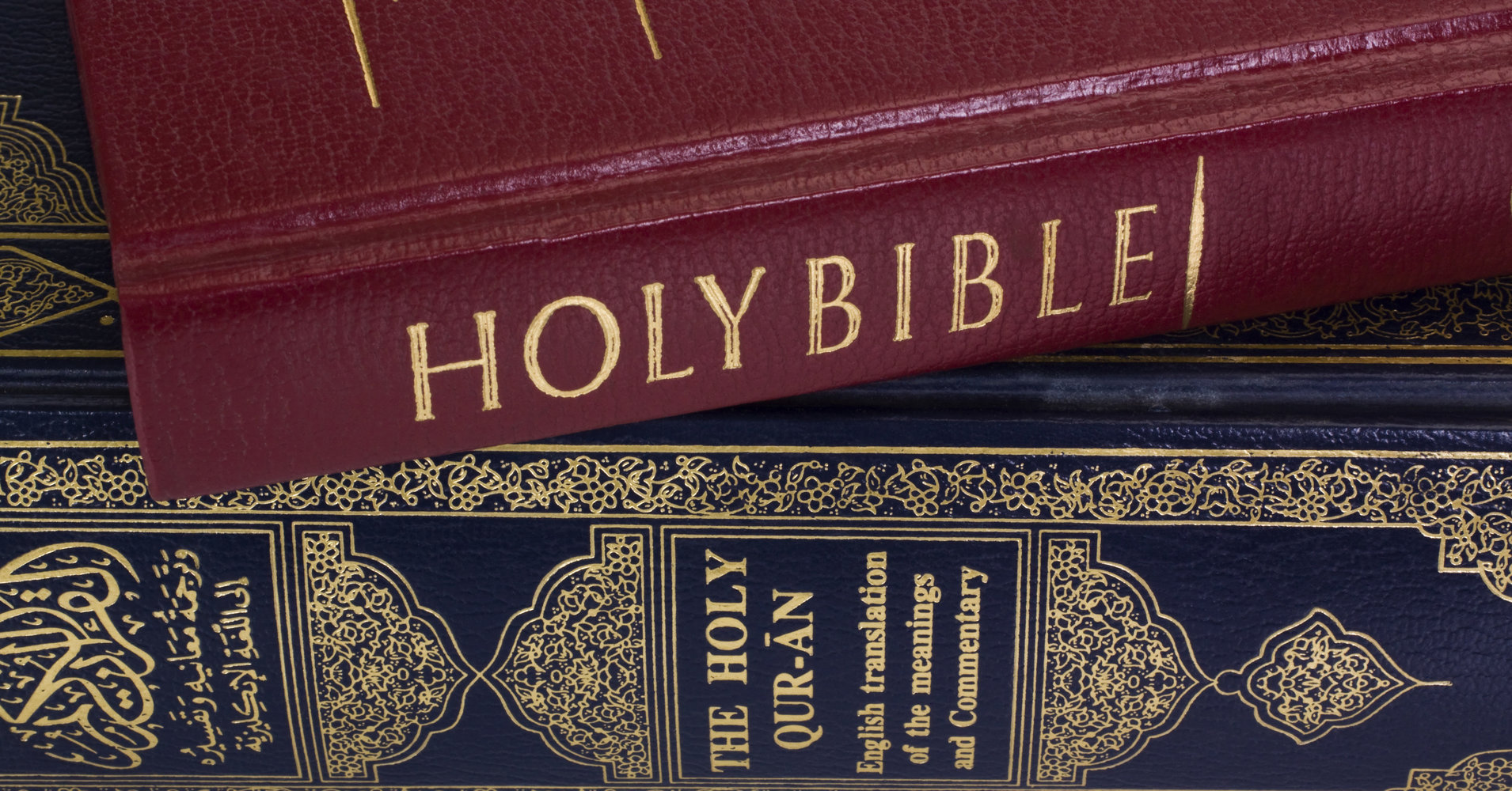 Close-up of the Koran and the Bible