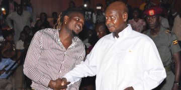 DJ Michael with President Museveni at an event last year.