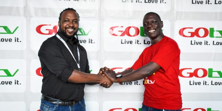 Dickson Zzizinga and MultiChoice Uganda's Head of Marketing Collin Asiimwe after the unveiling.