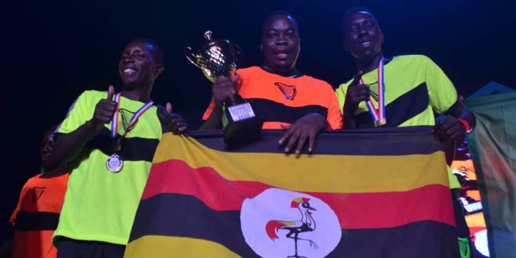 Uganda's Solomon Muleyi with teammates Ahmed Kassa and Andrew Asiimwe Elochu after their triumph.