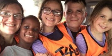 Ziz York with her two children during their 'eye-opening' holiday in Uganda.