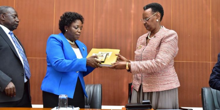 Minister for Education and Sports Janet Museveni receiving UCE Exam results recently.