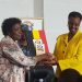 UNEB Chairperson Prof Mary Okwakol handing over 2019 Exam results to Janet Museveni, Minister of Education and Sports at the Office of the Prime Minister today.