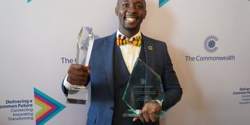 WINNER: Brian Galabuzi Kakembo with his awards.