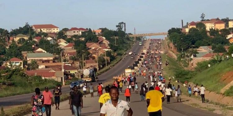People jogging long the Kampala Northern Bypass. PHOTO BY KASOOBA WILLIM/Matooke Republic.