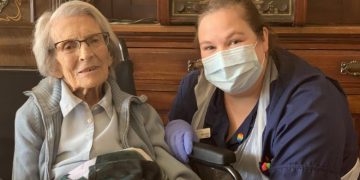 Connie Titchen, 106, with a nurse. COURTESY PHOTO.
