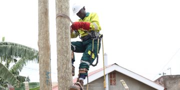 A Umeme field technician attends to a customer. The power distributor has maintained its technical teams who attend to faults in Kampala, Entebbe and Mukono areas, as well as entire upcountry faults teams, which are fully operational. The specialized teams that attend to big breakdowns and vital installations such as factories, healthcare facilities, security installations, and other vital facilities have also remained on standby.