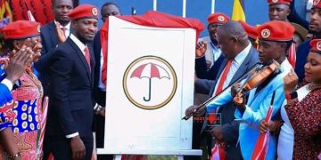 Bobi Wine unveiling the National Unity Platform logo at the People Power Offices.