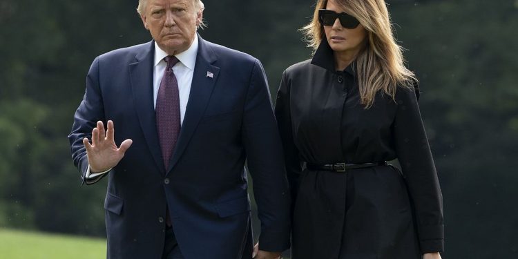 (FILES) In this file photo taken on September 11, 2020 US President Donald Trump and First Lady Melania Trump return to the White House in Washington, DC. - US President Donald Trump said on October 1, 2020 evening that he and the First Lady will quarantine as they await results from a test for Covid-19 after close advisor Hope Hicks tested positive for the disease. (Photo by ANDREW CABALLERO-REYNOLDS / AFP)