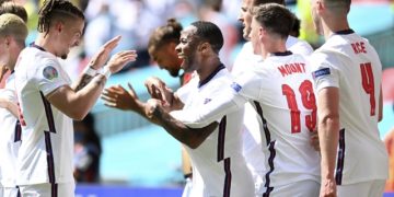 England's Raheem Sterling, center, celebrates with his teammates after scoring his side's opening goal during the Euro 2020 soccer championship group D match between England and Croatia at Wembley stadium in London, Sunday, June 13, 2021. (Glyn Kirk/Pool Photo via AP)