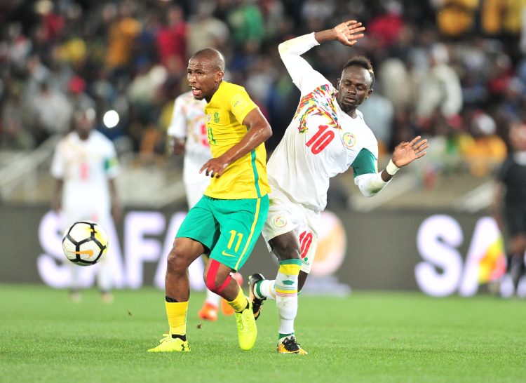 Kamohelo Mokotjo of South Africa challenged by Sadio Mane of Senegal during the 2018 World Cup Qualifiers football match between South Africa and Senegal at Peter Mokaba Stadium, Polokwane on 10 November 2017 ©Samuel Shivambu/BackpagePix