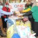Pius Oketcho, the Headteacher of Mulago School for the Deaf received the donated items from QNET's representatives.