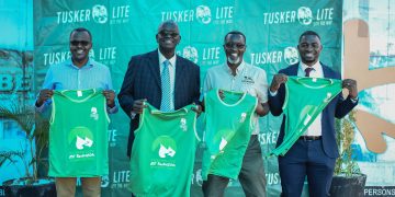 (L-R) Emmy Hashakimana, UBL’s Marketing & Innovations Director, Andrew Kilonzo, UBL’s Managing Director, Amos Wekesa and Collin Masiga of Equator Hikes during the unveiling of the new Tusker Lite Rwenzori Marathon kits at the Uganda Breweries head offices in Luzira on Thursday.