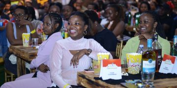 Attendees enjoy some healthy laughter during the show.