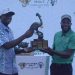 Managing Director UBL Andrew Kilonzo hands over the trophy to the winner of the Tusker Malt Uganda Golf Professionals Open, Robson Chinhoi at the recently concluded tournament.
