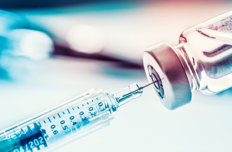 Close-up medical syringe with a vaccine.