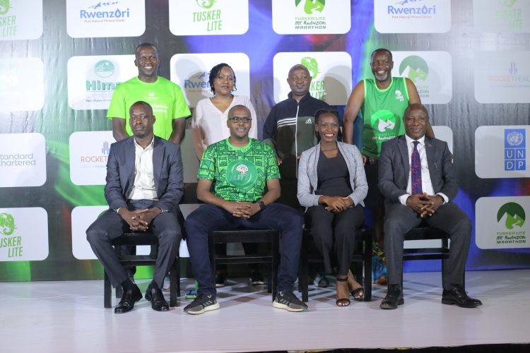 Organisers and sponsors pose for a photo moment at the Tusker Lite Mt Rwenzori Press Conference.