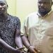 Mubarak Munyagwa and his co-accused stand together in court.