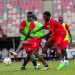 Halid Lwalilwa challenging Milton Karisa for the ball during training at the Japoma Stadium in Cameroon.
