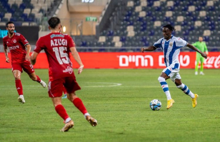 Aziz Kayondo (wearing blue and white) in action for Leganes.