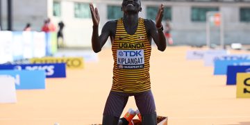 BUDAPEST, HUNGARY - AUGUST 27: Victor Kiplangat of Team Uganda celebrates at the finish line after winning the Gold medal in the Men's Marathon during day nine of the World Athletics Championships Budapest 2023 on August 27, 2023 in Budapest, Hungary. (Photo by Shaun Botterill/Getty Images)