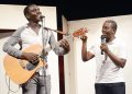 Singer Kenneth Mugabi and Fun Factory comedian Richard Tuwangye on stage.