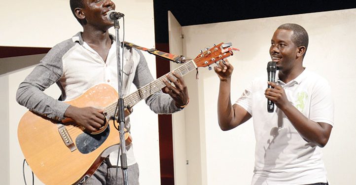 Singer Kenneth Mugabi and Fun Factory comedian Richard Tuwangye on stage.