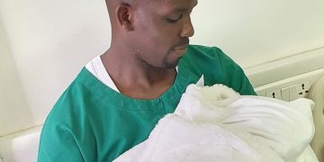 Ssenyonyi and the newborn baby.