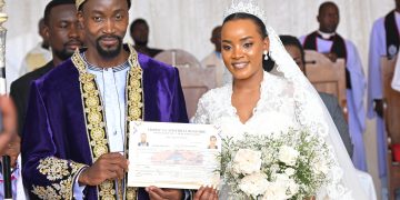 Kyabazinga William Gabula Nadiope IV and Inebantu Jovia Mutesi pose with their marriage certificate.