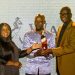 UBL Board Member Racheal Dumba and UBL Managing Director Andrew Kilonzo gifting the President of the Uganda Golf Union Moses Matsiko with a  personalised Johnnie Walker Bottle.
