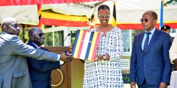 UNEB officials handing over the 2023 UACE results to Minister of Education and Sports Janet Museveni.